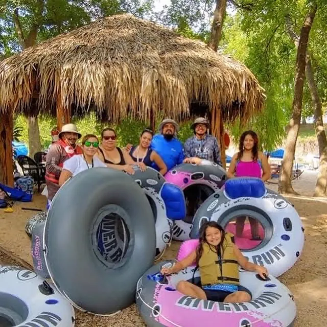 Palm-thatched cabana by the river
