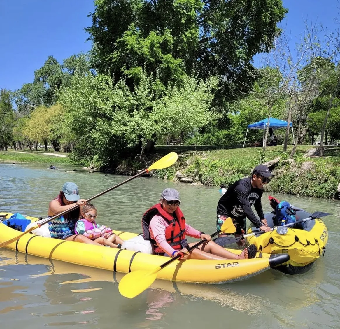 Family kayaking on the river