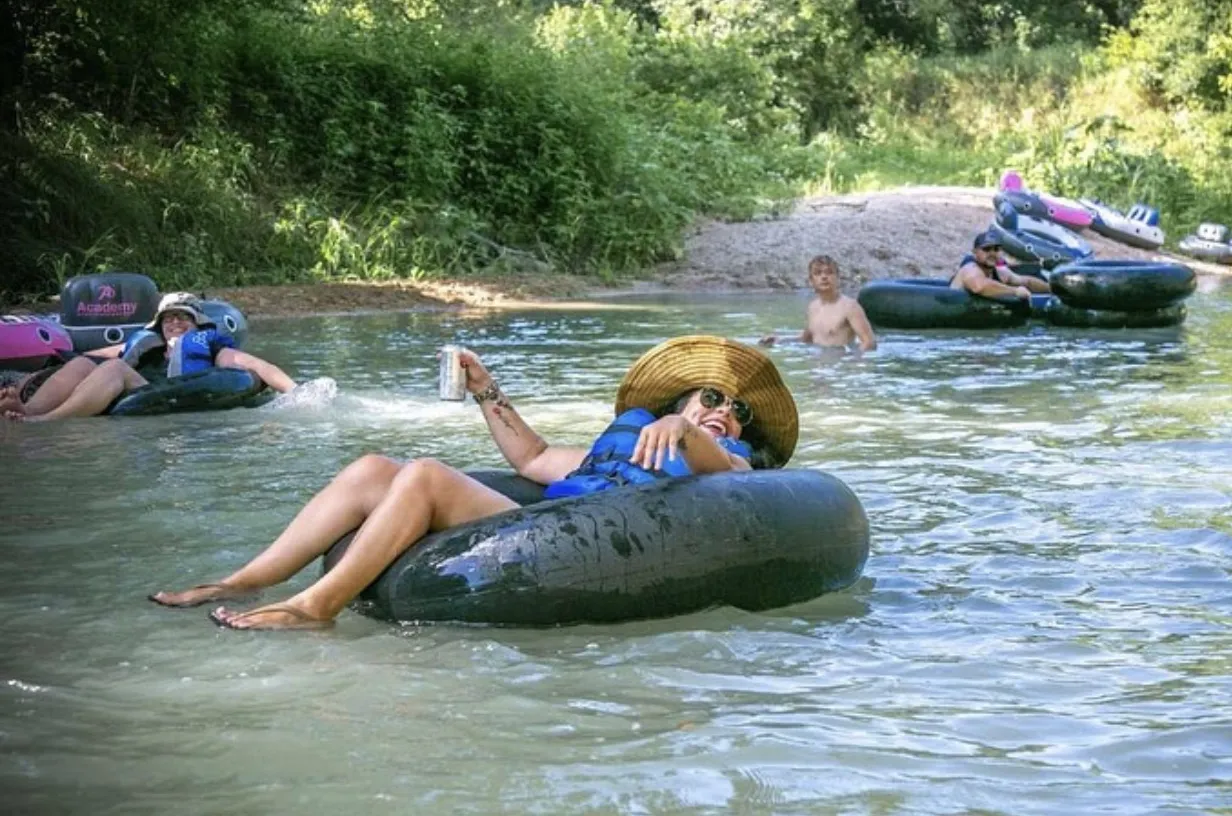 Woman tubing with straw hat