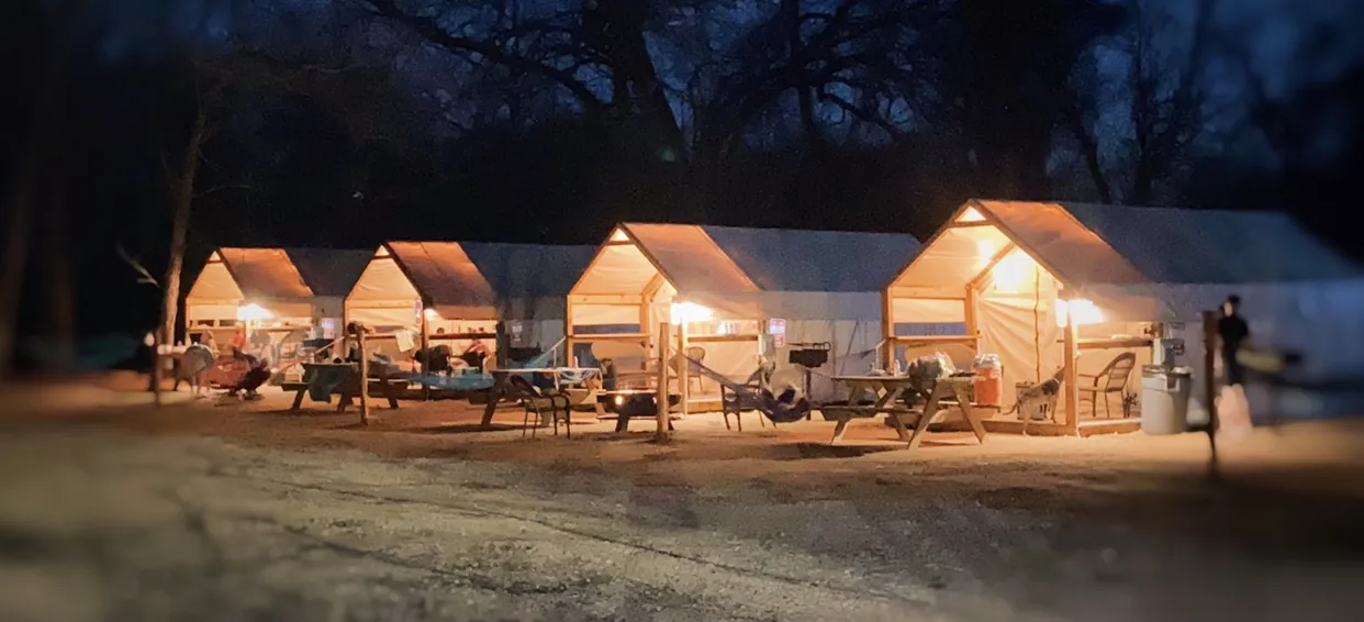 Glamping Cabins row at night