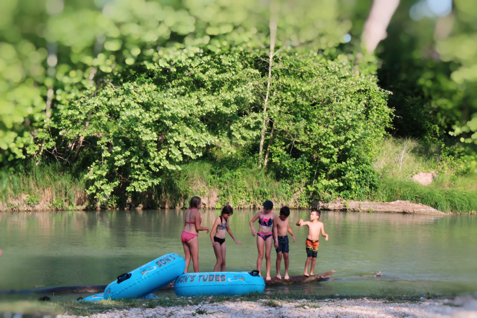 Families enjoying spring break on the San Marcos River