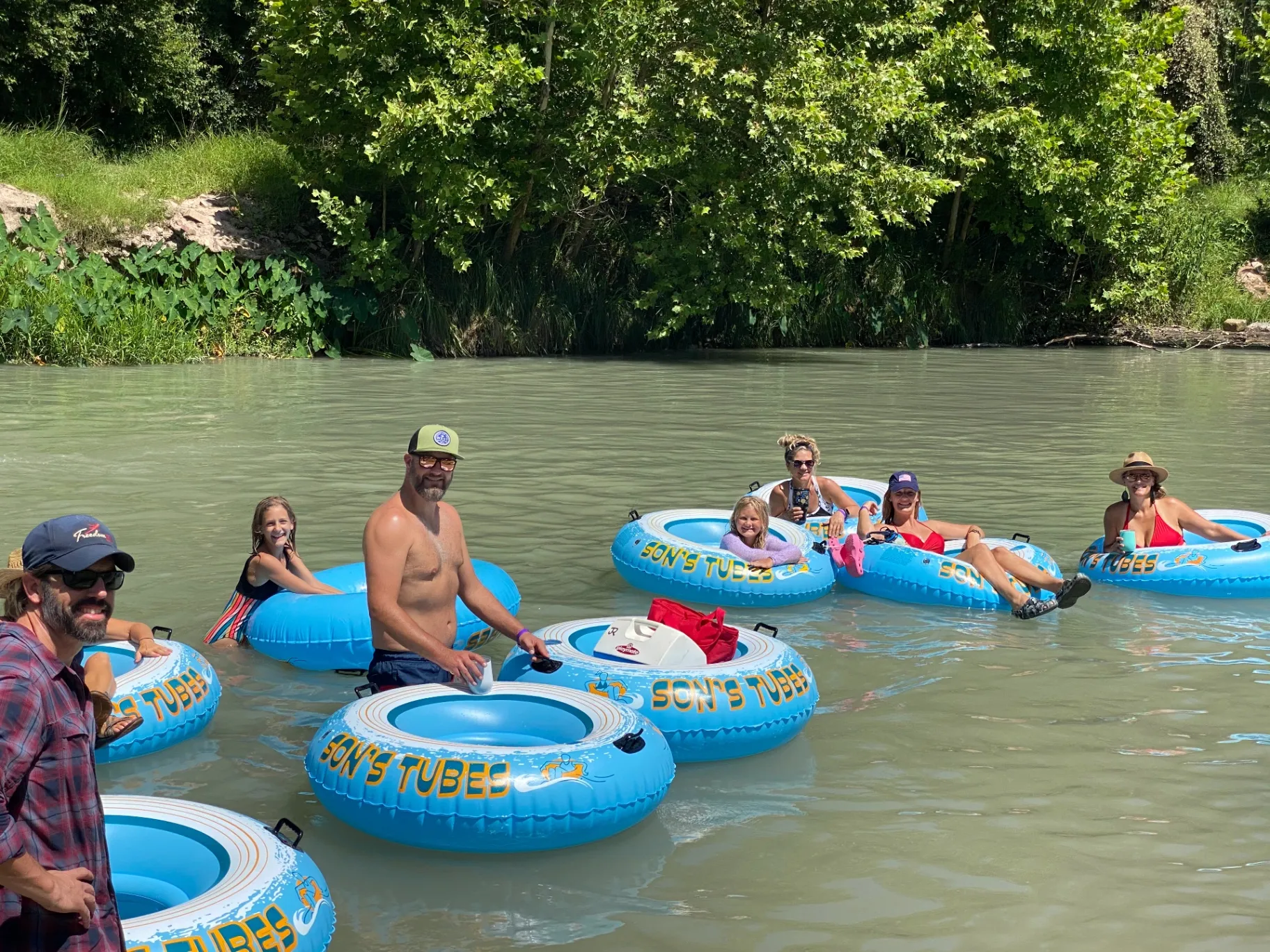 Son's tubes family float near Austin